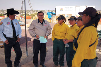 Photo courtesy C. Jackson, Navajo Nation Navajo female camp crew, Wallow Fire 1 and Navajo fighters (L to R) Apache County Sheriff Joseph Dedman Jr. and President Ben Shelly visited with Navajo firefighters Michelle Albert, Chassity Lee, Fiona Tsosie and Moriko Nez stationed at the supply unit at the Incident Command Post in Eagar. 